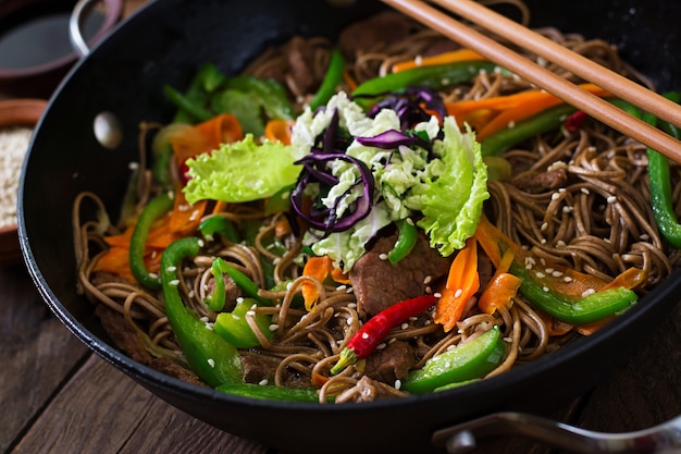 Soba noodles with beef, carrots, onions and sweet peppers