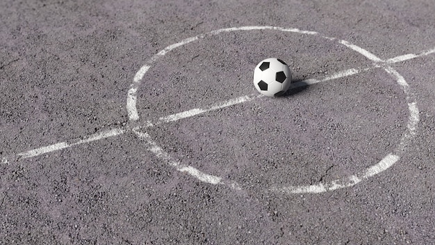 Soccer ball on asphalt