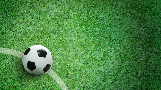 Soccer ball on green grass in stadium with copy space