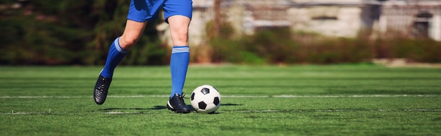 Soccer ball on green playground. Soccer concept