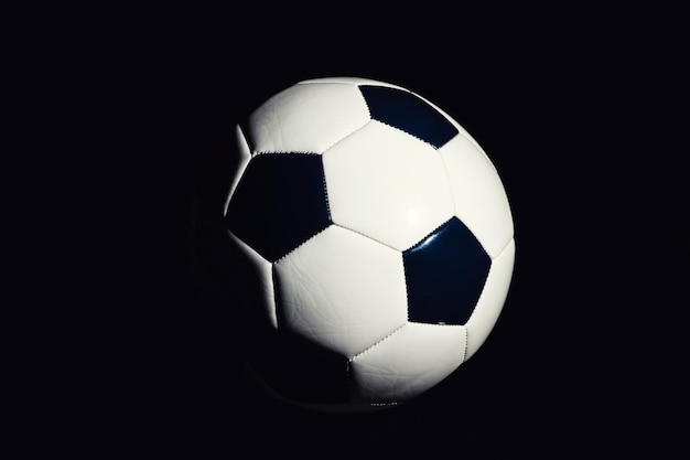 Soccer ball isolated on black background