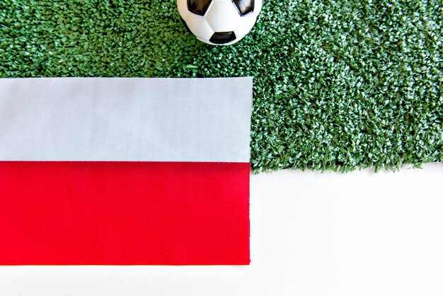 Soccer ball and Polish flag on white background