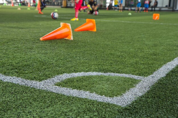 Soccer ball tactics on grass field with cone for training thailand in  background Training children