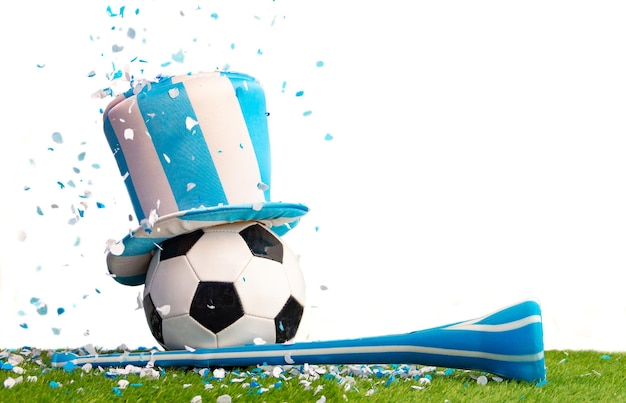 Soccer ball with top hat vuvuzela and light blue and white confetti