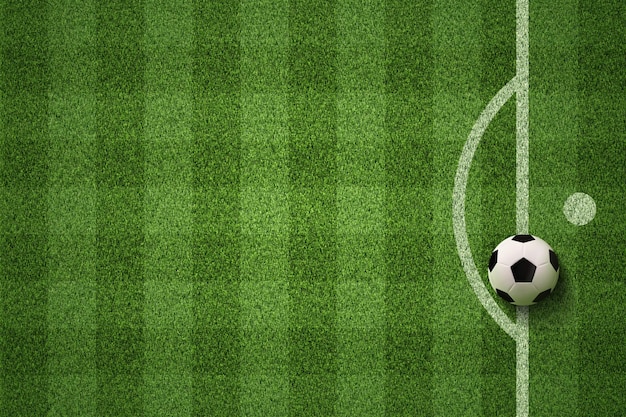 Soccer field or Football field with soccer ball on green grass background