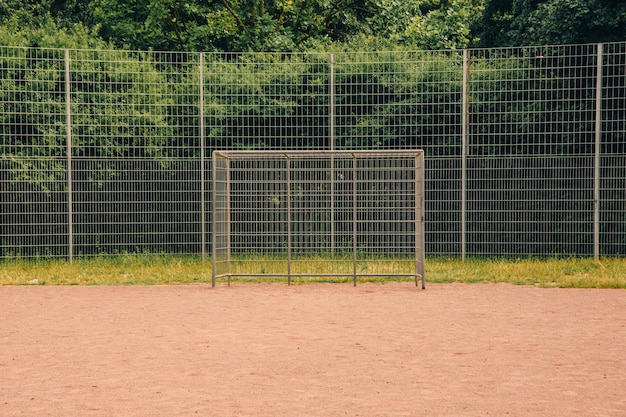 Soccer net on an empty sand field