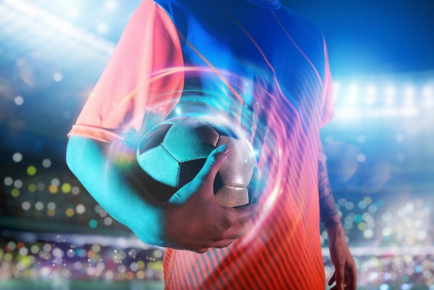 Soccer player ready to play with soccerball at the stadium