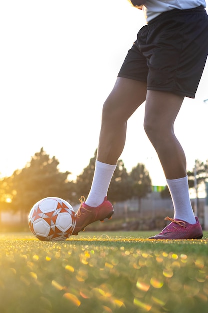 Soccer player running after the ball