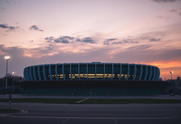 a soccer stadium with the lights on in the background