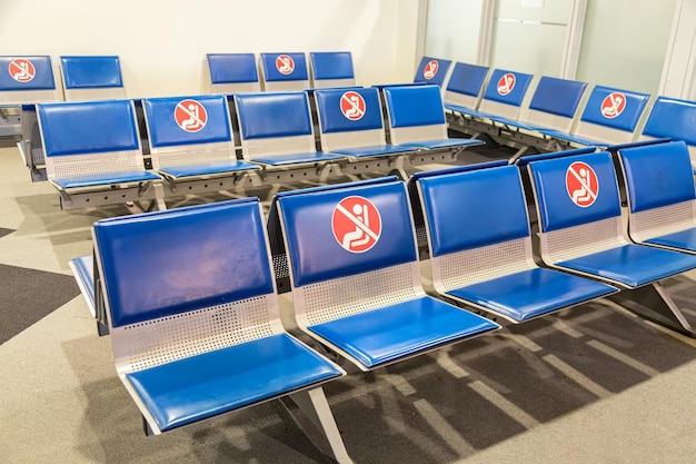 Social distancing COVID19 concept Passenger seats at Departure airport terminal during the corona virus