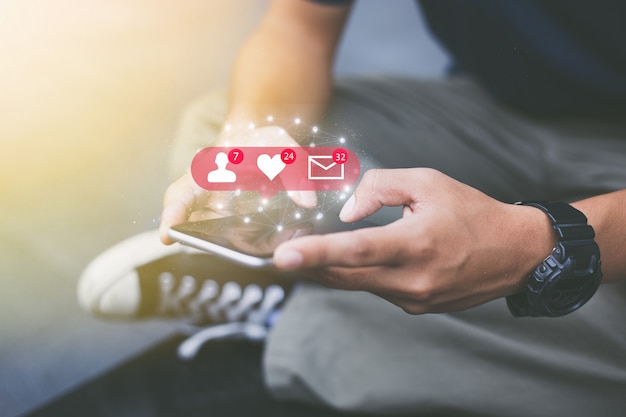 Social media network concept.Close-up of man hands using mobile phone