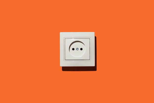 socket on an orange wall