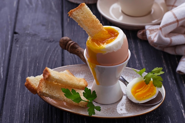 Soft-boiled egg and toasts 