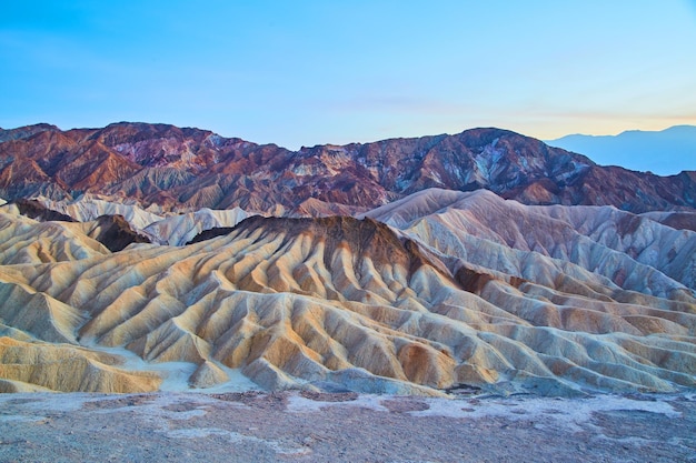 Soft dusk light at Zabriskie Point with colorful waves of sediment