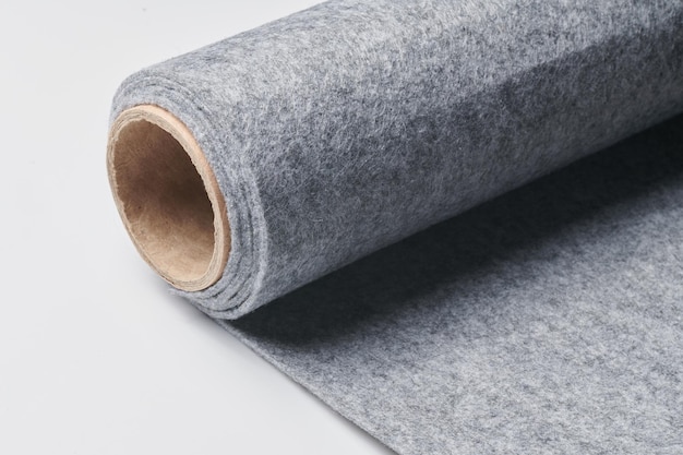 Soft felt textile material gray color colorful texture fabric roll closeup