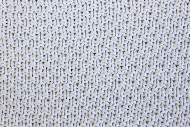 Soft light natural texture of knitted wool textile material background White crochet cotton fabric woven canvas