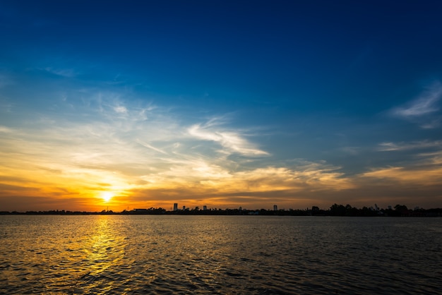 Soft and motion blur cloud on blue sky at riverside in sunset time