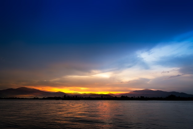 Soft and motion blur cloud on blue sky at riverside in sunset time