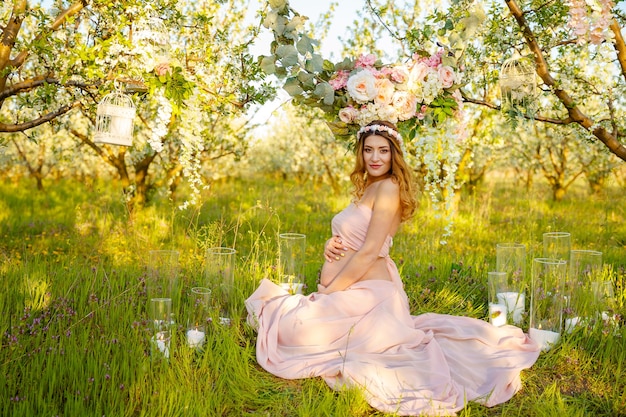 Soft and sensual pregnant woman with flowers beautiful pregnant girl