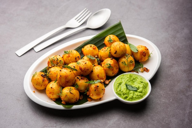 Soft and spongy Idli balls or goli idly with green and red chutney south indian food recipe