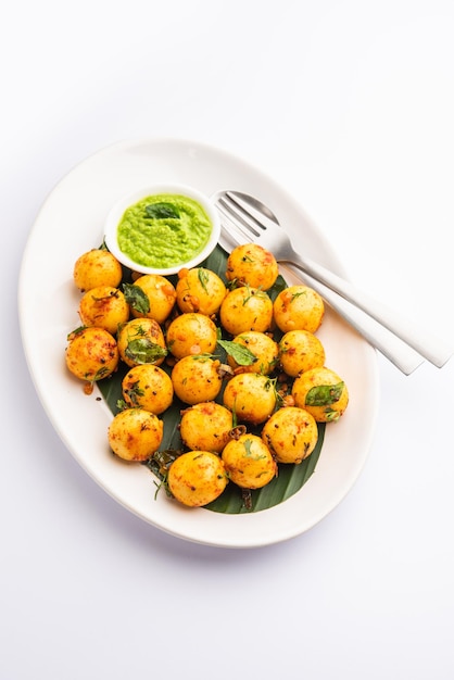 Soft and spongy Idli balls or goli idly with green and red chutney south indian food recipe