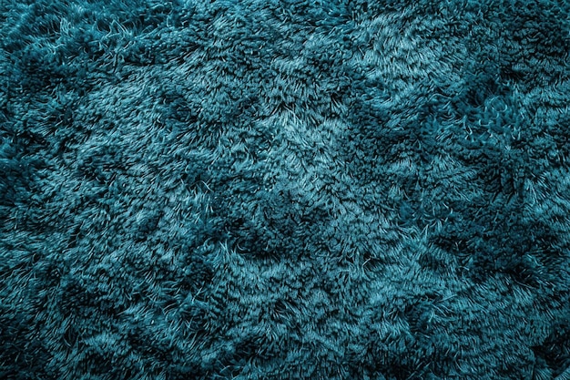 Photo soft teal shag carpet texture in a cozy indoor space captures the essence of comfort and warmth