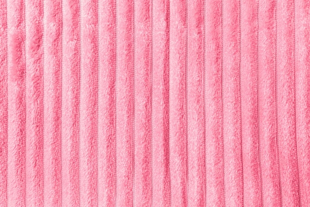 Soft throw fleece fabric with lines Texture for background in color of the year 2023 Viva Magenta