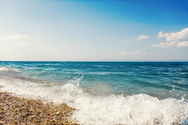 Soft wave of blue ocean on sandy beach Background