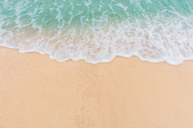 Soft wave of sea on empty sandy beach Background with copy space