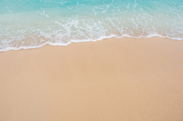 Soft wave of sea on empty sandy beach