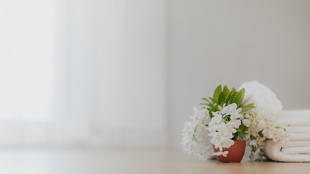 Soft white towels and flowers