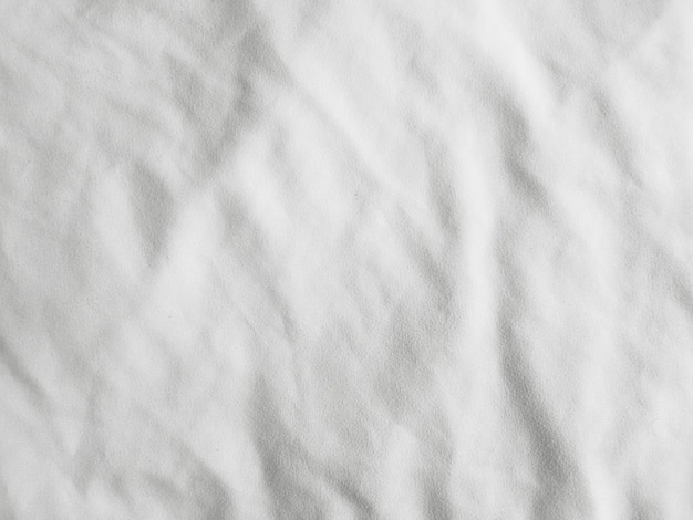 Soft white wrinkled fabric background