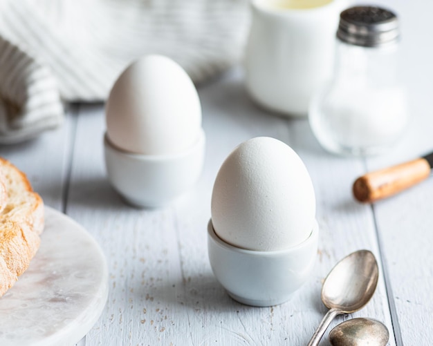 Softboiled eggs breakfast on a white background selective focus