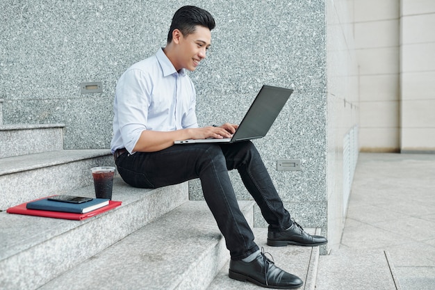 Software developer working on laptop