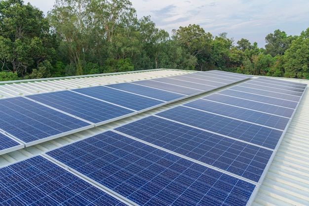 Solar cells panel installed on the roof of a large building are full of dirt and dust.