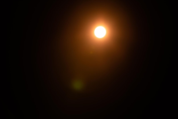 Solar lens flare on black background