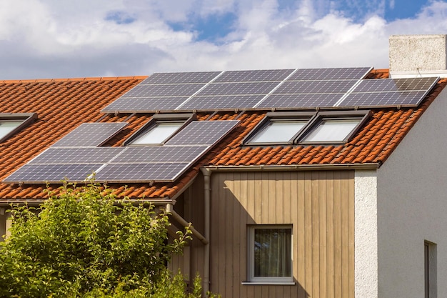 Solar Panel station on private House Roof Solar panels on tiled roof with windows