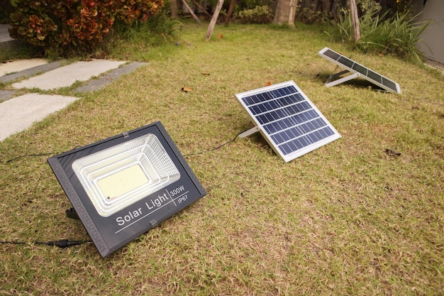 Solar panel with spotlight in the house garden