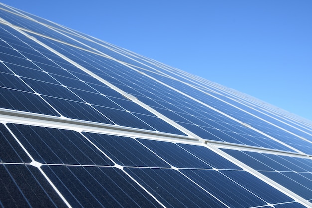 Solar panels against blue sky.Against The Deep Blue Sky in suny weather