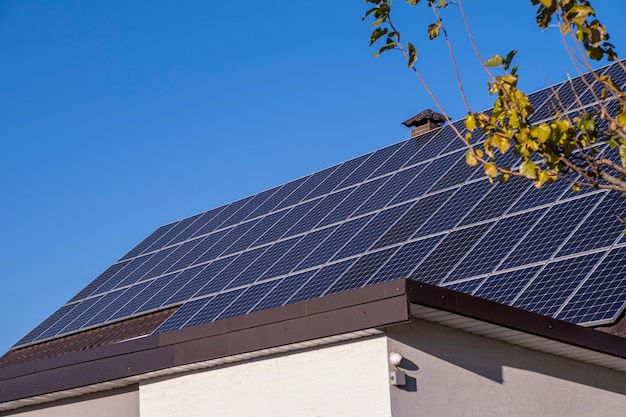 Solar panels on the roof of the house, in the fall.