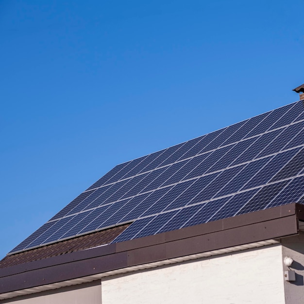 Solar panels on the roof of the house, in the fall.