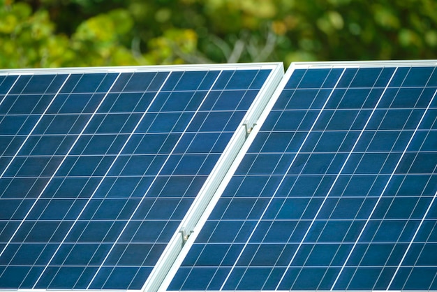 Solar photovoltaic panels mounted on standalone frame on backyard ground for generating of clean ecological electric energy Concept of autonomous house