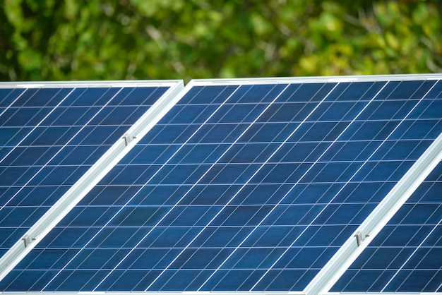 Solar photovoltaic panels mounted on standalone frame on backyard ground for generating of clean ecological electric energy Concept of autonomous house