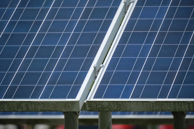 Solar photovoltaic panels mounted on standalone frame on backyard ground for generating of clean ecological electric energy Concept of autonomous house