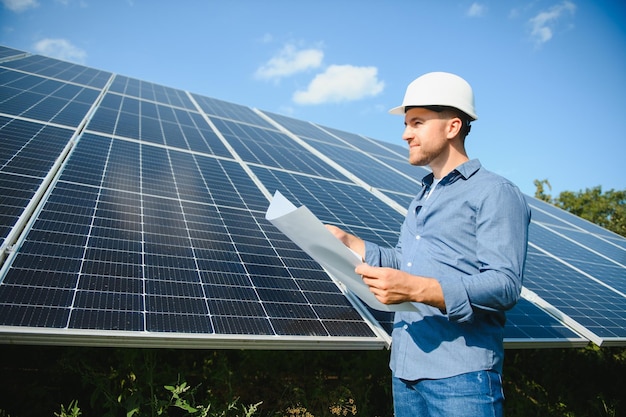 Solar power plant Engineer on a background of photovoltaic panels Science solar energy