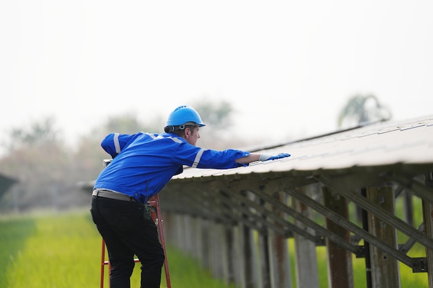 Solar power plant engineer examining photovoltaic panels technician maintenance electric solution