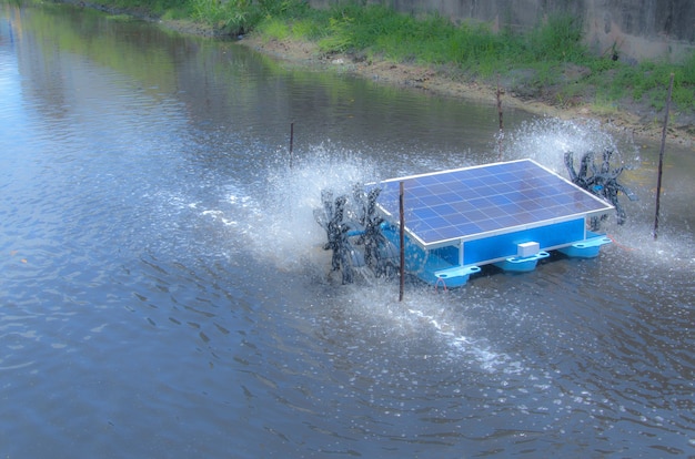 Solar powered turbine water wheel working in canal of an industrial plant