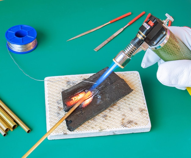 Soldering brass with a gas burner on a charcoal stove