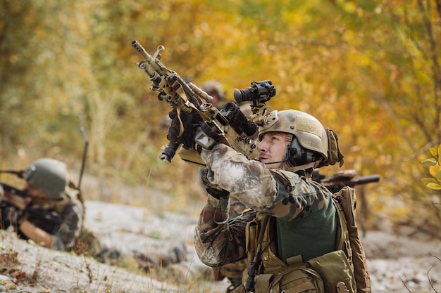 Solders aiming at a target of weapons