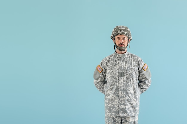 Soldier in camouflage on color